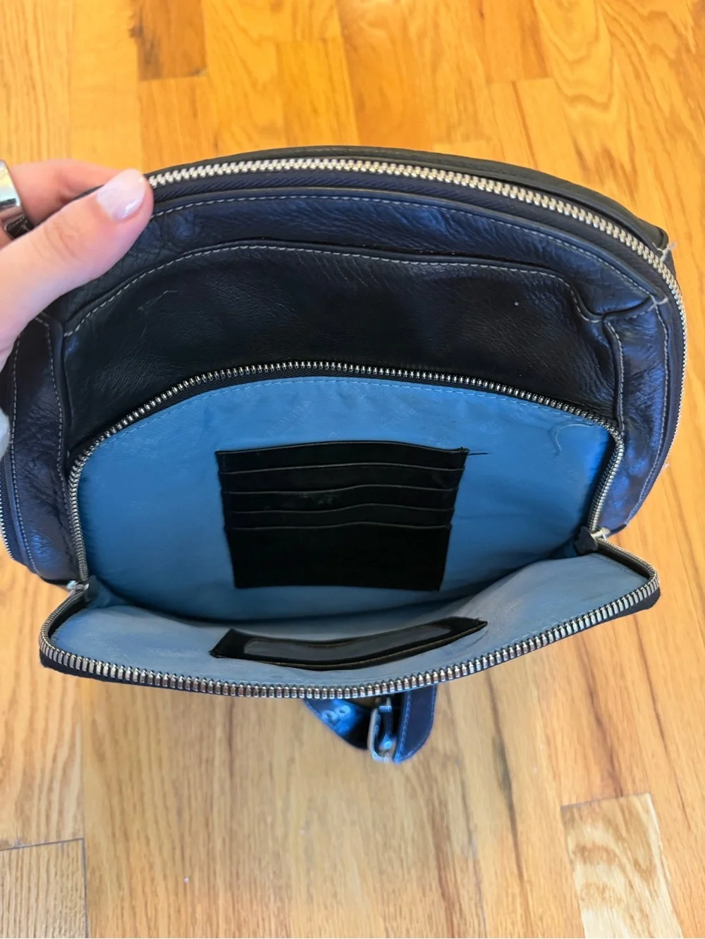 Perlina Black Leather Backpack with Front Zip Pocket